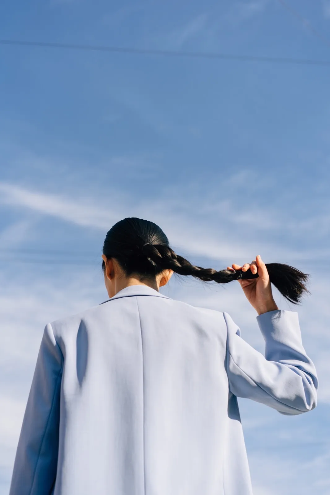 A young professional looking to the open sky