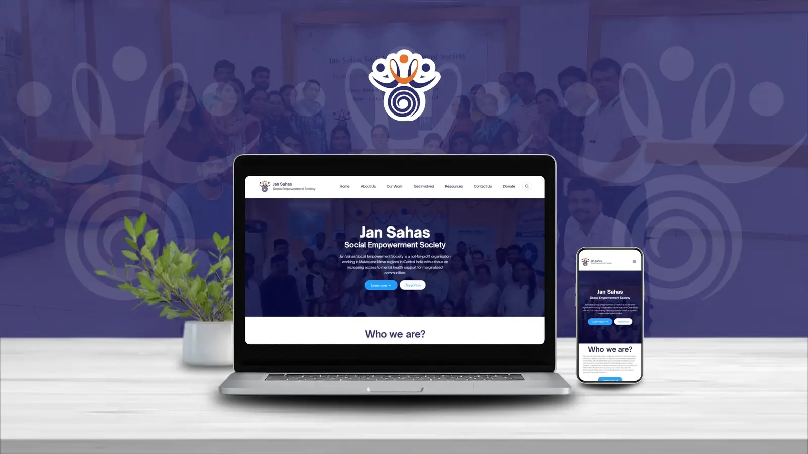 Screen recording of the JSSES platform homepage scrolling on laptop and mobile mockups, over a photo of the JSSES team